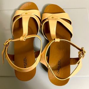 Cream colored strappy sandal with low wedge heel